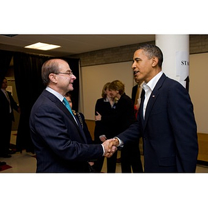 University President Aoun and President Obama shaking hands