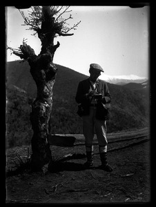 Joseph Obrebski, standing by a tree [no caption]