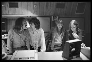 David Crosby and Graham Nash singing, with Joni Mitchell and Judy Collins (l. to r.), in the control room at Wally Heider Studio 3 during production of the first Crosby, Stills, and Nash album