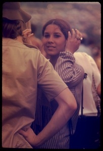 Woman brushing back her hair during the Woodstock Festival