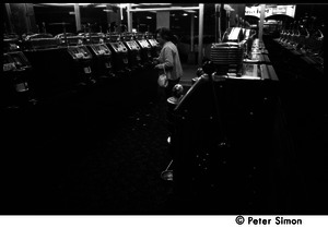 Woman playing slot machines in a casino