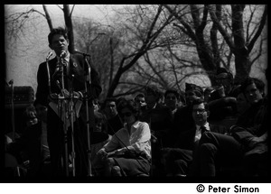 Resistance on the Boston Common: Staughton Lynd addressing the crowd, Noam Chomsky (2d from right) and Terry Cannon (far right) on stage