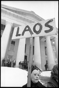 Antiwar demonstrator in mask and cloak protesting the invasion of Laos at the Vermont State House