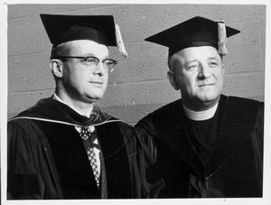 John W. Lederle and Michael P. Walsh in academic regalia