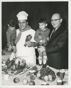 Dr. Salvatore DiMichael with chef and young clients at Thanksgiving celebration