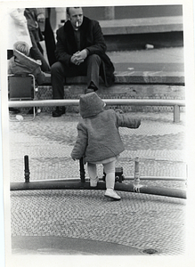 Child walking over a fountain component in Boston Common