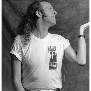 Abe Rybeck posing in an "Adult Children of Heterosexuals" t-shirt