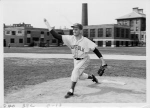 Suffolk University men's baseball player Fred Knox pitches the ball toward home plate, 1961