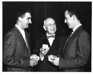 Two students receive pins from Suffolk University President Dennis C. Haley (1960-1965), 1961