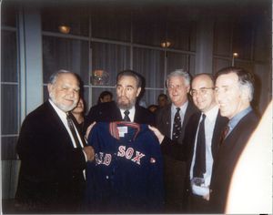 Members of the Massachusetts congressional delegation present Cuban President Fidel Castro with a Boston Red Sox jacket during trip to Cuba, 1998