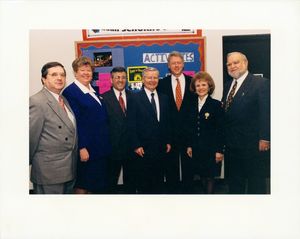 Group photograph of President Bill Clinton event, John Joseph Moakley is at far right, William Bulger is fourth from right, Clinton is third from right