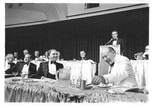 Walter Mondale at the podium of a political event at the Washington Hilton with Congressmen John Joseph Moakley and Thomas P. "Tip" O'Neill, 1980s