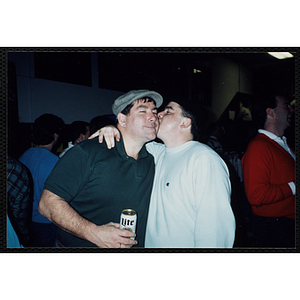 Two Bunker Hillbilly alumni embrace at a reunion event