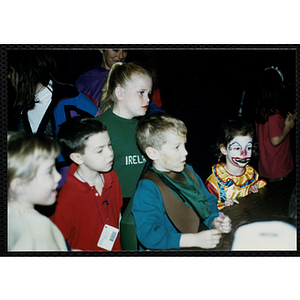 Children in Halloween costumes attend a party