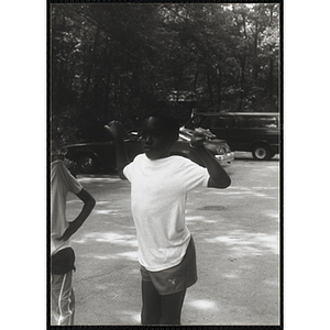 A Boy dances during a group activity at a camp