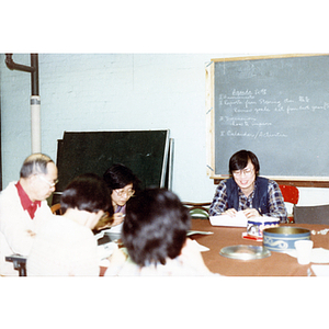 Chinese Progressive Association members at a staff meeting