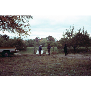 People in an orchard on a Chinese Progressive Association trip