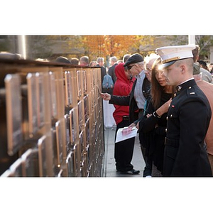 A man in uniform looks at the Veterans Memorial at the dedication ceremony