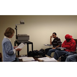 A teacher and two Torch Scholars in class