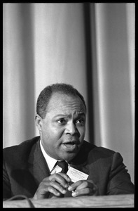 James Farmer, seated on a panel at the Youth, Non-Violence, and Social Change conference, Howard University