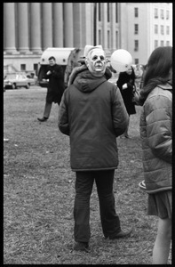 Protester at the Counter-inaugural demonstrations, 1969, with a mask on the back of his head