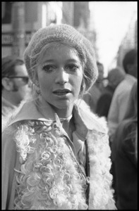 Woman in a knit cap and fur coat at the Vietnam Moratorium