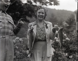 Osa Johnson, holding fish she has caught