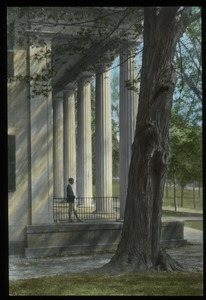 Boy on porch with huge white columns