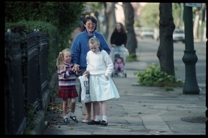 Mother and daughters walking down a Dublin street