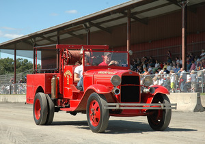 Franklin County Fair: antique fire engine driving past the grandstands