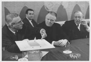 Robert D. Gordon showing Christopher J. Weldon, Harry C. Solomon and Gerald Grady architectural plans for football stadium