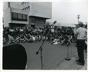 Board of Trustees fee increase demonstration: Vice Chancellor for Student Affairs Robert W. Gage speaking to protestors, Herter Hall in background