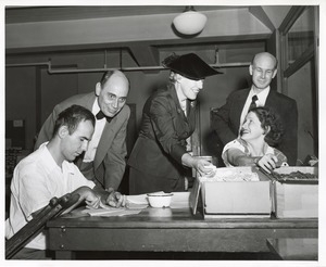 Mary Switzer observes clients at work at the Institute for the Crippled and Disabled