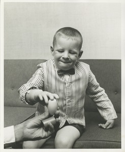 A young boy uses his new prosthetic hand