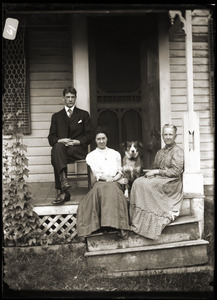 Young couple, dog, and elderly women seated on steps (Greenwich, Mass.)
