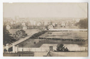 Crowd surrounding first football game on Pratt Field (1910)
