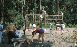 Crowd and girt emplacement at the Moon Barn Raising at entrance to Hopkins Forest on 2 August 1975.