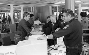 Mayor Kevin White, unidentified man, and police officer in Boston Police Dispatch Operations Center