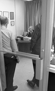 Mayor Kevin White using telephone in office