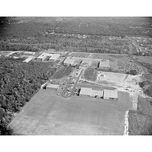 Suburban location of industrial buildings, some new construction, unidentified