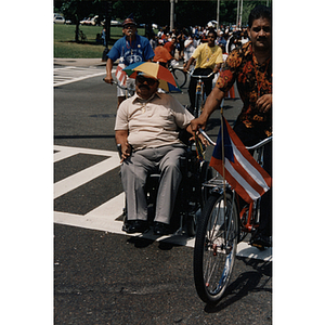 A man in a wheelchair during the Festival Puertorriqueño parade