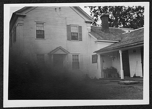 A white house with side porch