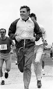 Mayor Raymond L. Flynn running on a beach