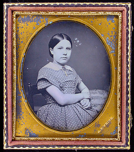 Three-quarter length portrait of an unidentified girl