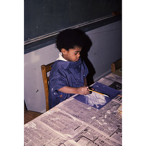 Young child working on an art project