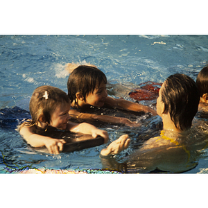 Children swimming using kickboards - Digital Commonwealth