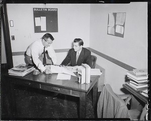 Two men at work in a Boston College office