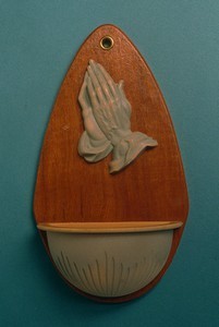 Praying hands holy water font