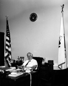 Thomas P. O'Neill sitting at desk in congressional office
