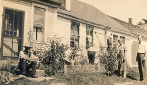 Grandfather before Vermont farmhouse